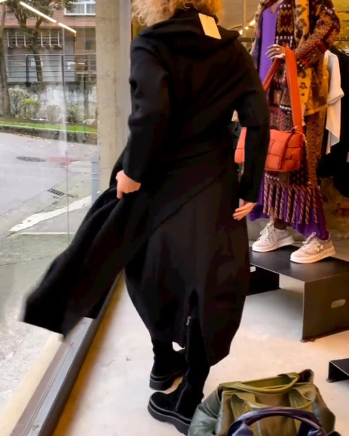 Timeless women's black midi dress. Featuring a comfortable long-sleeve design, round neck, and elegant A-line silhouette.