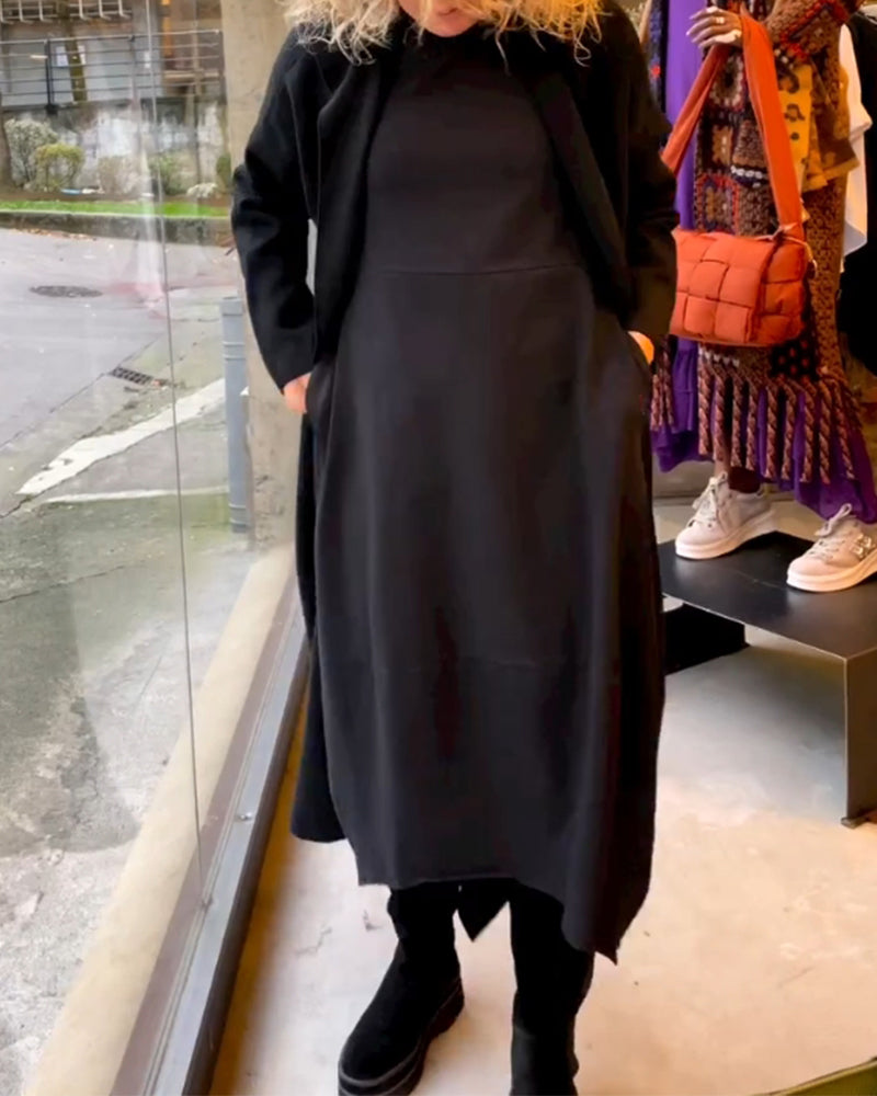 Comfortable and elegant women's black midi dress. Classic long-sleeve, A-line, round neck for sophisticated style.