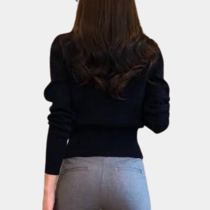 Soft knit women's classic cardigan with button front. Cozy and comfortable knitwear for stylish casual layering.