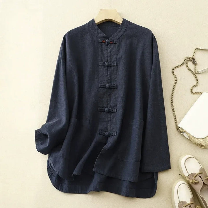 Women's classic button-front shirt with elegant knot closures, long sleeves, and practical patch pockets.
