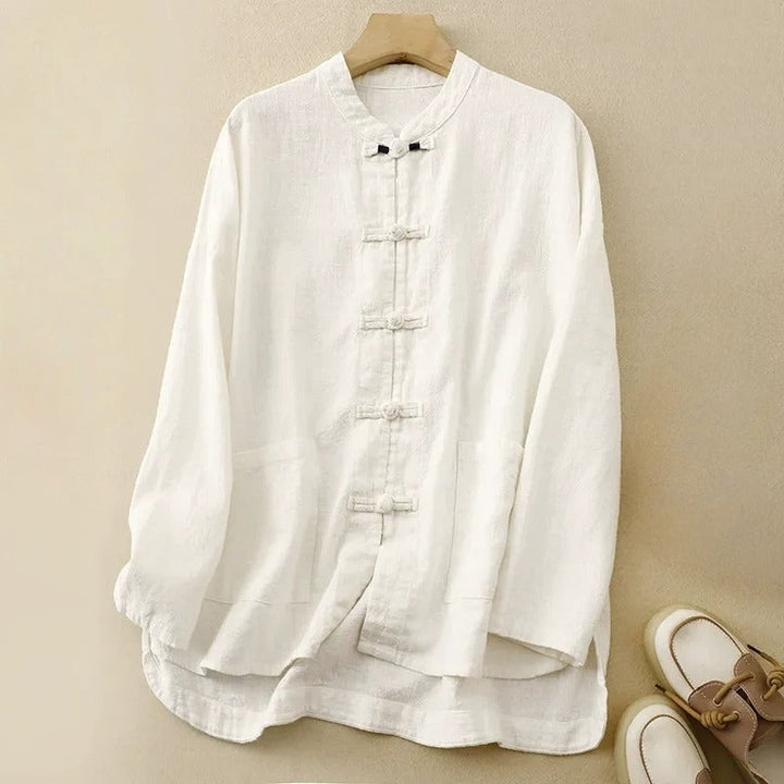 Sophisticated women's long-sleeve button-front shirt, versatile for casual wear, featuring unique knot closures.