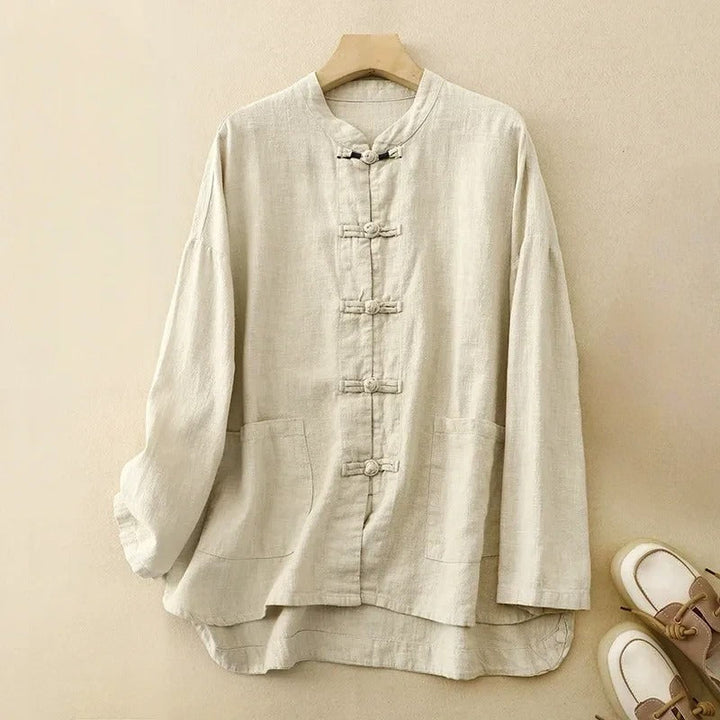 Classic women's long-sleeve shirt with elegant button-front, unique knot closures, and front patch pockets.