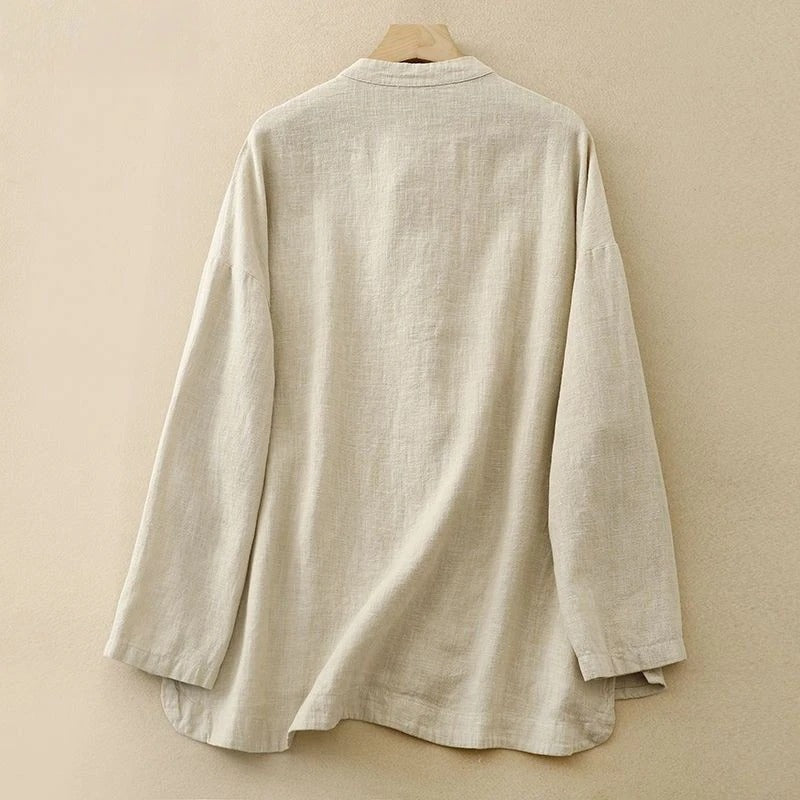 Versatile women's button-front shirt, a sophisticated classic with distinctive knot closures & long sleeves.