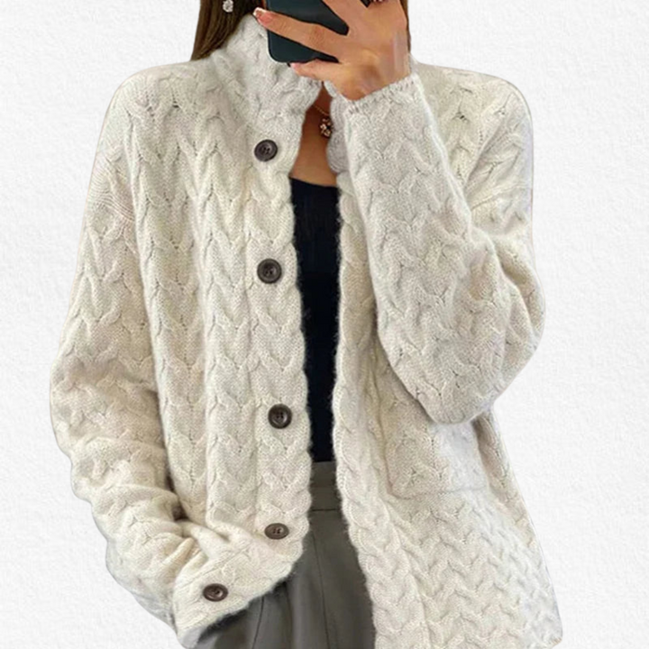 Women's classic chunky cable knit button-up cardigan in a relaxed fit, perfect for casual layering.