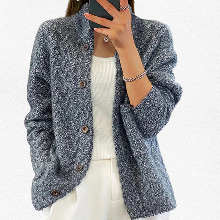 Elegant women's chunky cable knit cardigan with button closure, offering classic style and comfort.