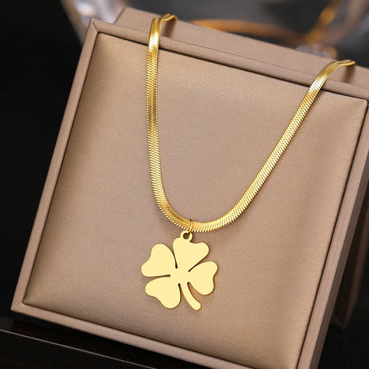 Classic four-leaf clover pendant necklace, sterling silver, elegant women's delicate jewelry piece.
