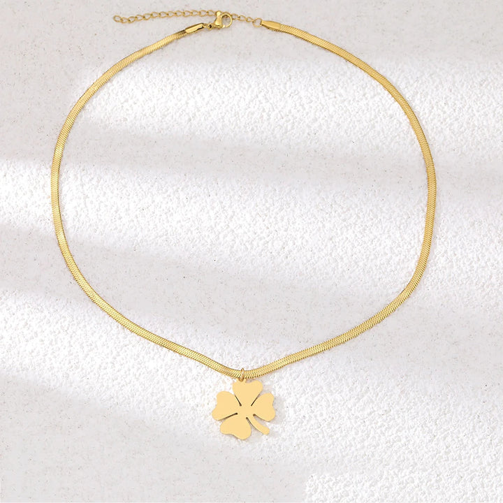 Elegant gold plated clover pendant necklace for women, a delicate and classic gift or fashion accessory.