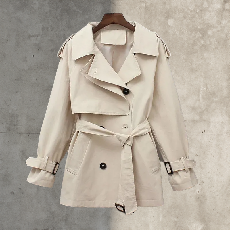 Stylish women's classic trench coat with double-breasted front & belt, ideal for fashion-forward spring apparel.