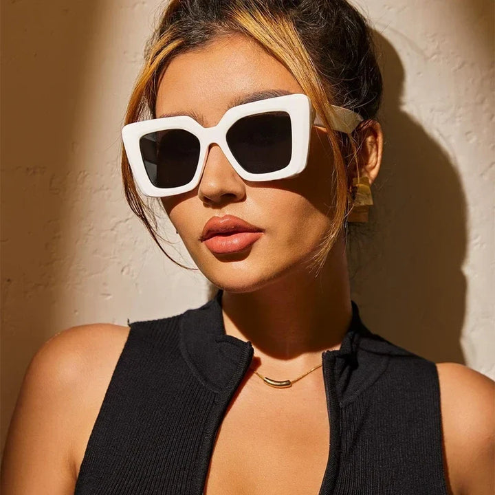 Black geometric women's sunglasses, a classic and fashionable statement accessory with UV protection.