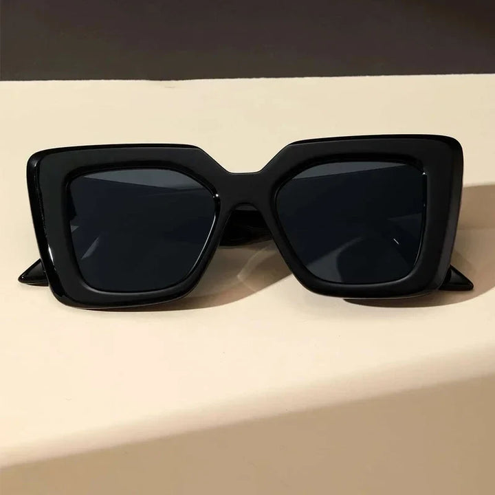 Modern classic geometric women's sunglasses. Fashionable eyewear accessory offering essential UV protection.