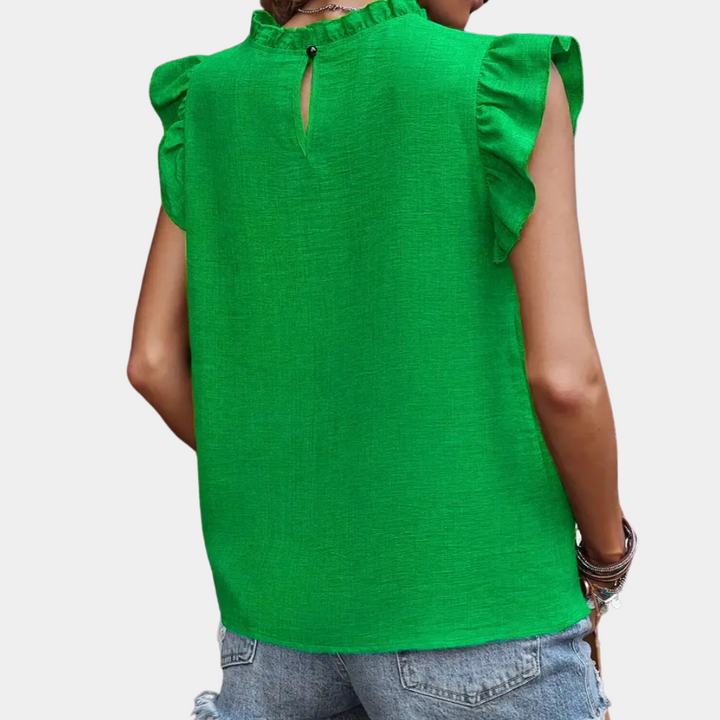 Versatile women's green ruffle blouse, a timeless fashion piece for both professional and casual occasions.