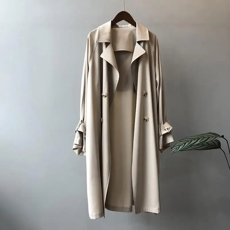 Women's classic long trench coat with sleek fit, ideal for elegant spring & fall fashion.