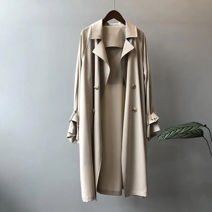 Women's classic long trench coat with sleek fit, ideal for elegant spring & fall fashion.