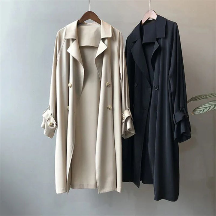 Sleek black long trench coat for women, versatile classic outerwear suitable for spring & office wear.