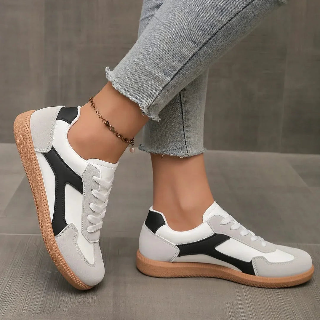 Stylish low-profile women's fashion sneakers, designed for versatile everyday wear & comfort.