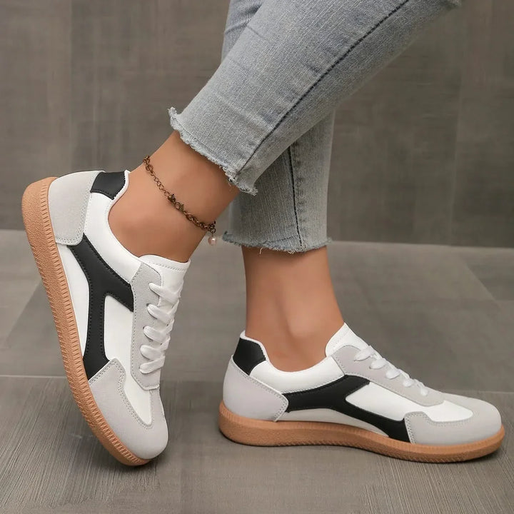 Stylish low-profile women's fashion sneakers, designed for versatile everyday wear & comfort.
