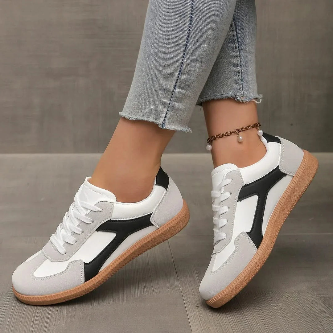 Versatile women's low-profile sneakers, classic design for comfortable everyday fashion footwear.