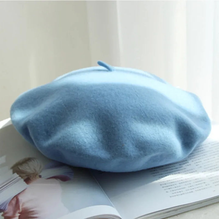 Stylish women's classic wool beret in olive green, a trendy winter accessory choice.