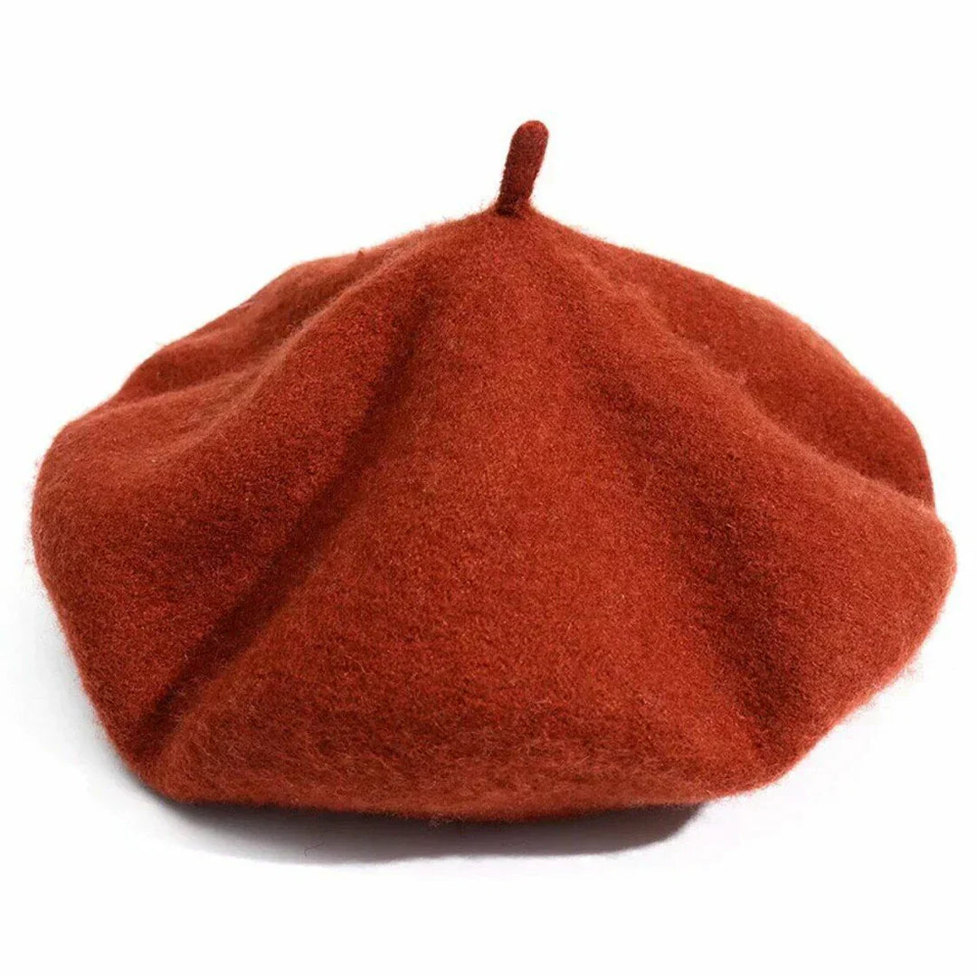 Close-up of a women's purple wool beret, showcasing the soft texture and timeless design.