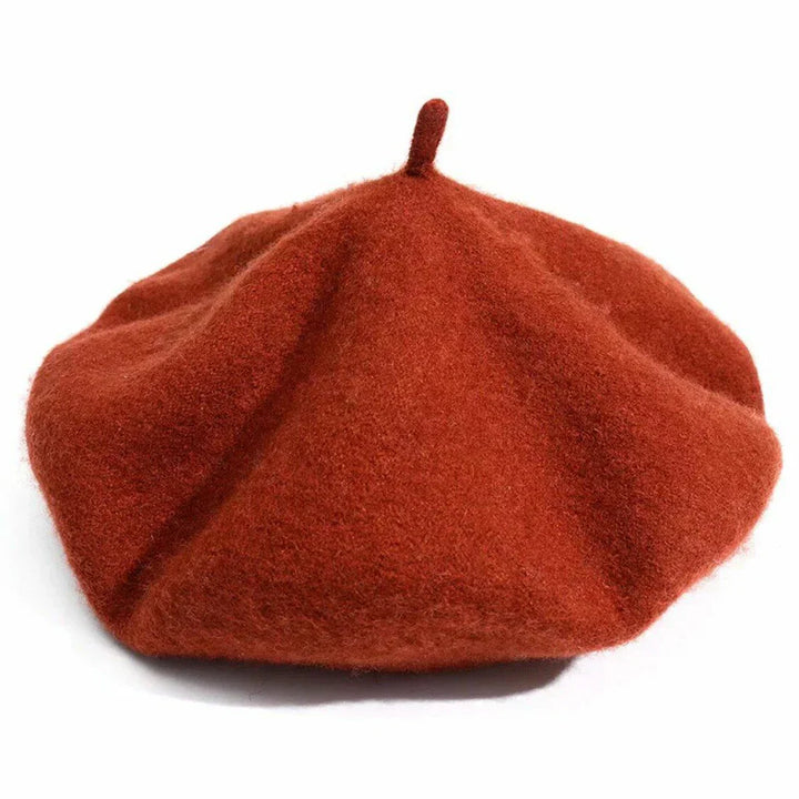Close-up of a women's purple wool beret, showcasing the soft texture and timeless design.