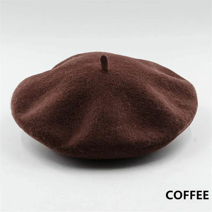 Fashionable women's classic wool beret in navy blue, a versatile winter accessory.