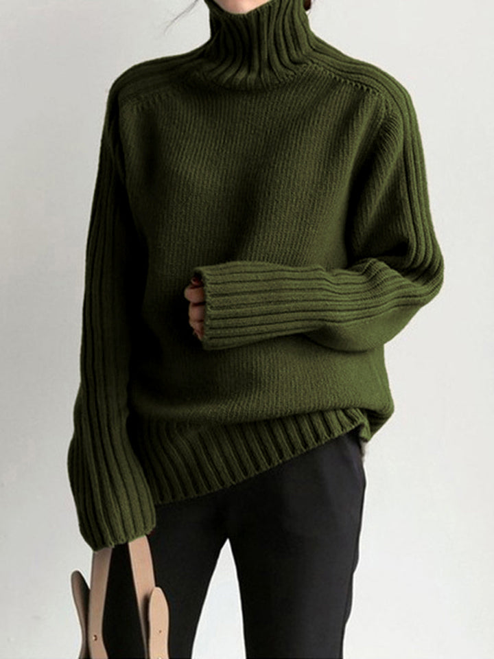 Classic women's green roll neck sweater, perfect for cold weather, offering a cozy, stylish, long sleeve fit.