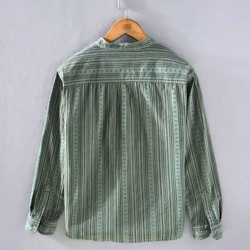 Green striped button-down shirt, women's long sleeve casual top. Ideal for workwear or relaxed everyday comfort.