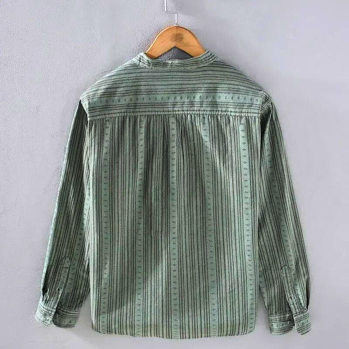 Green striped button-down shirt, women's long sleeve casual top. Ideal for workwear or relaxed everyday comfort.