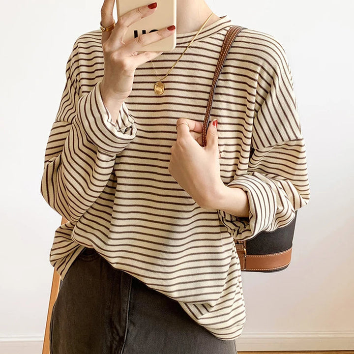 Comfortable women's striped crewneck shirt, a versatile layering piece for chic casual wear.