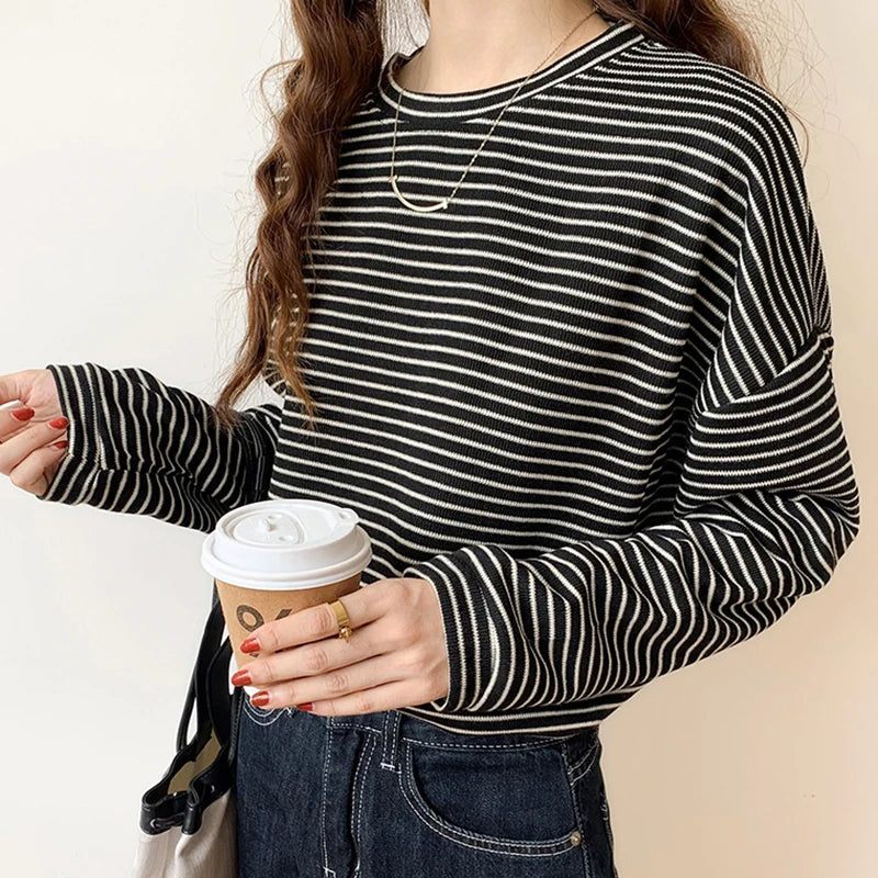 Classic women's striped crewneck shirt, offering a comfortable & chic look for everyday fashion.