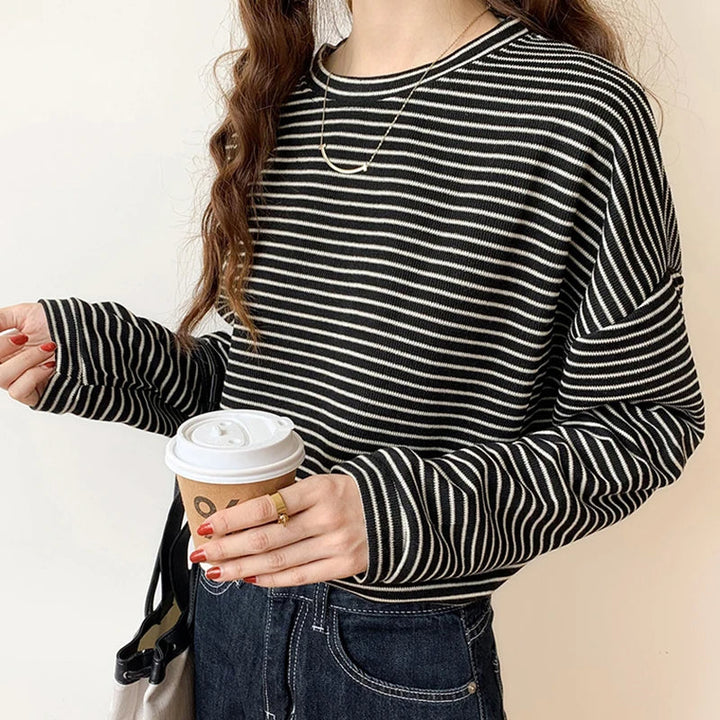 Classic women's striped crewneck shirt, offering a comfortable & chic look for everyday fashion.