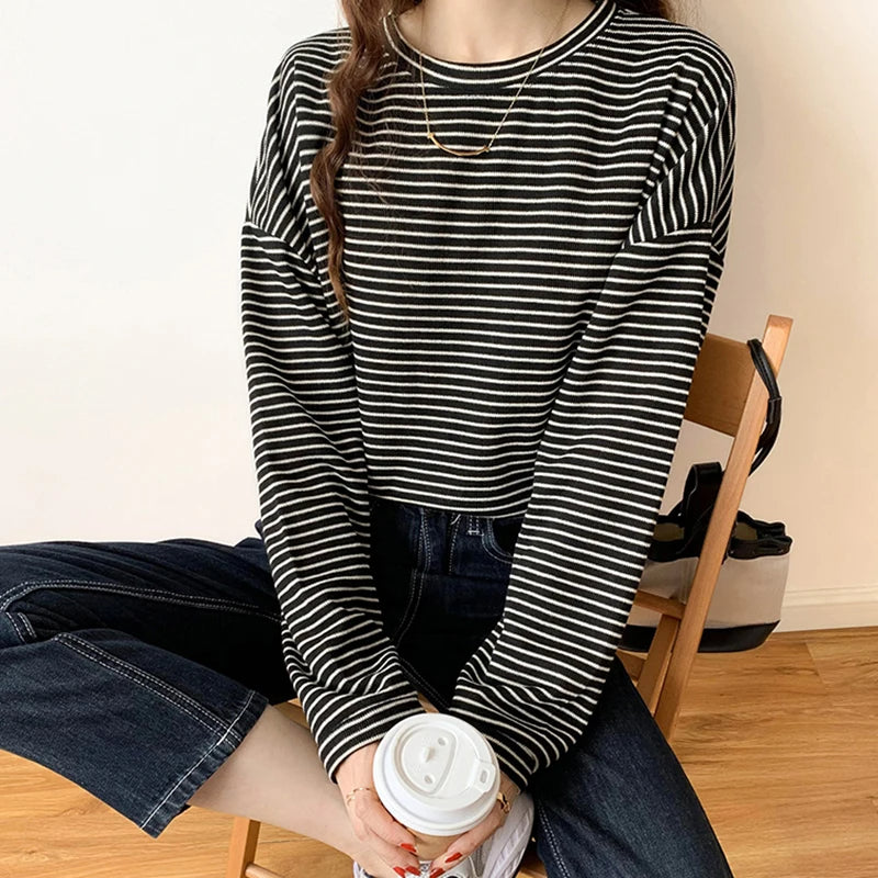 Relaxed fit women's striped crewneck top, a versatile layering piece for comfortable everyday style.