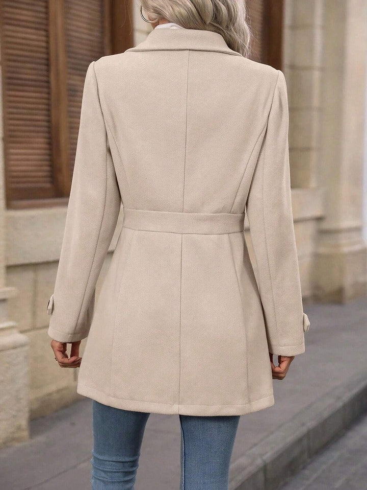 Stylish women's long trench coat. Versatile outerwear with adjustable belt for fall & winter elegance.
