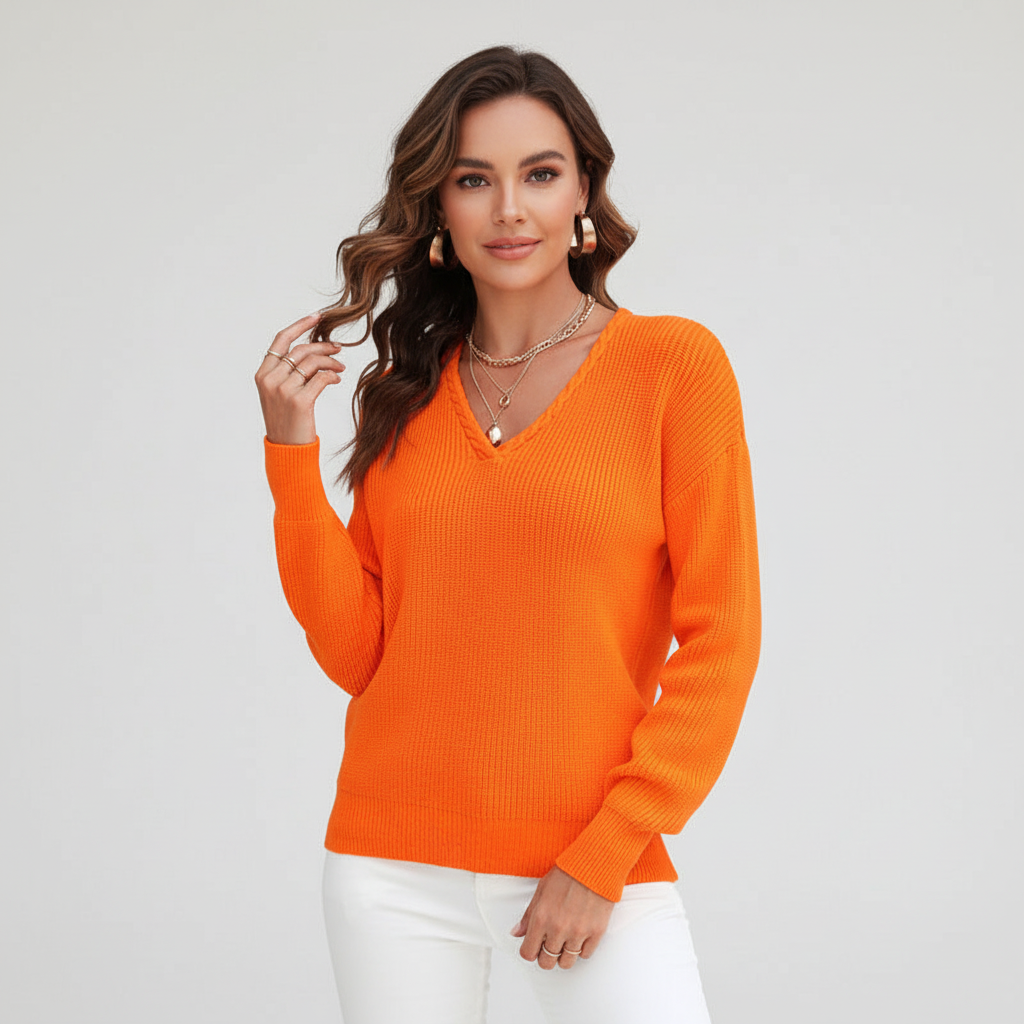 Detail of the knit pattern on a women's classic V-neck sweater, emphasizing its quality.