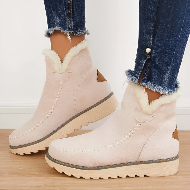 Practical women's warm winter boots. Non-slip snow booties with orthopedic support for comfortable everyday wear.