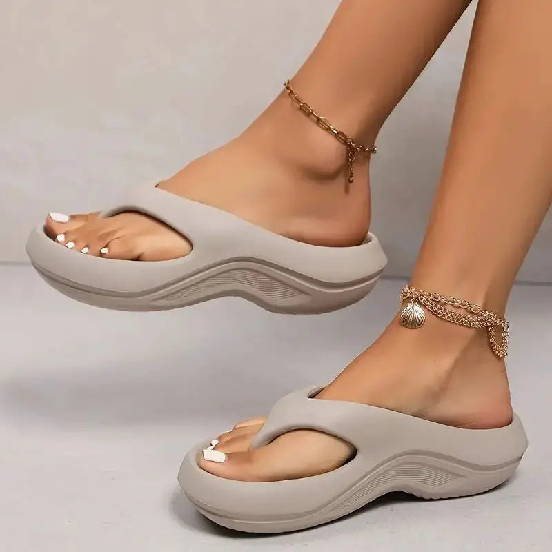 Women's cloud-like platform flip flops for ultimate comfort & arch support. Perfect summer beachwear.