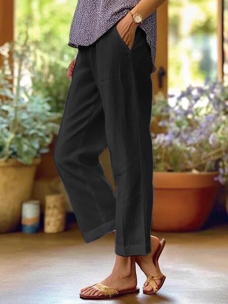 Elegant women's flowy straight-leg trousers in a breathable fabric, offering coastal style & comfort.