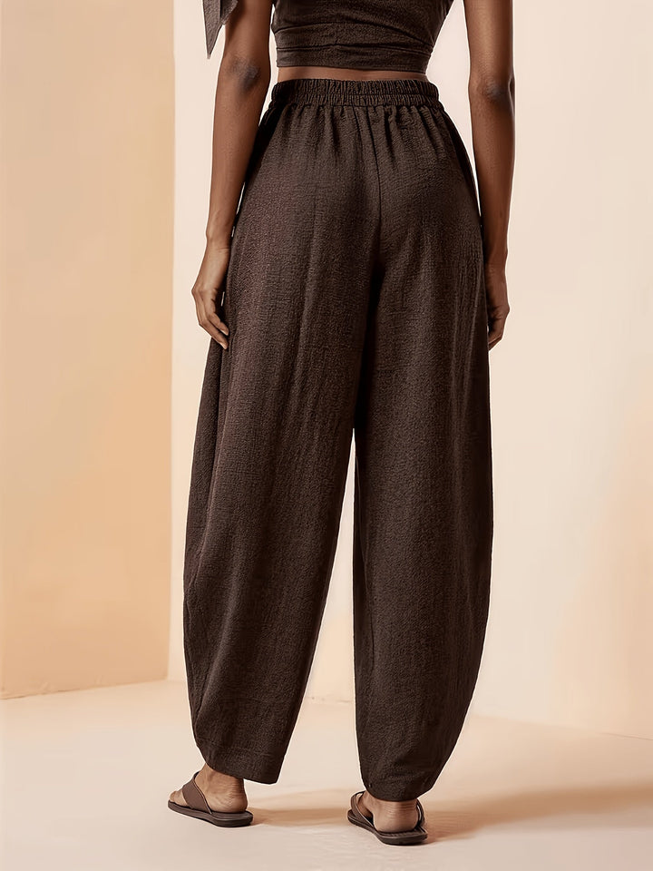 Relaxed fit women's coffee brown harem pants, high-waist & tapered ankle. Perfect for casual wear & travel.