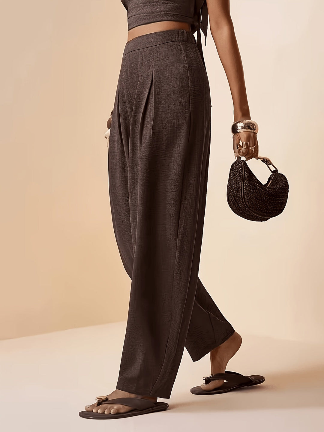 Chic coffee brown pleated harem pants for women. Features high waist, tapered ankle & loose, comfortable fit.