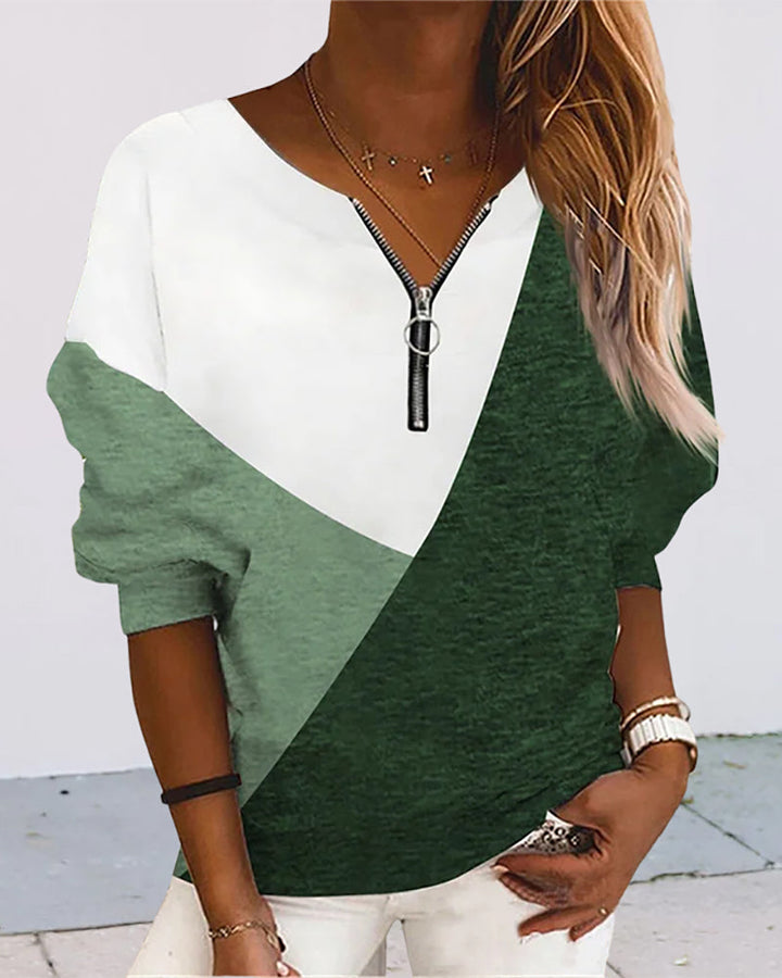 Stylish color block zip sweatshirt for women. V-neck design offers versatile, everyday comfort.