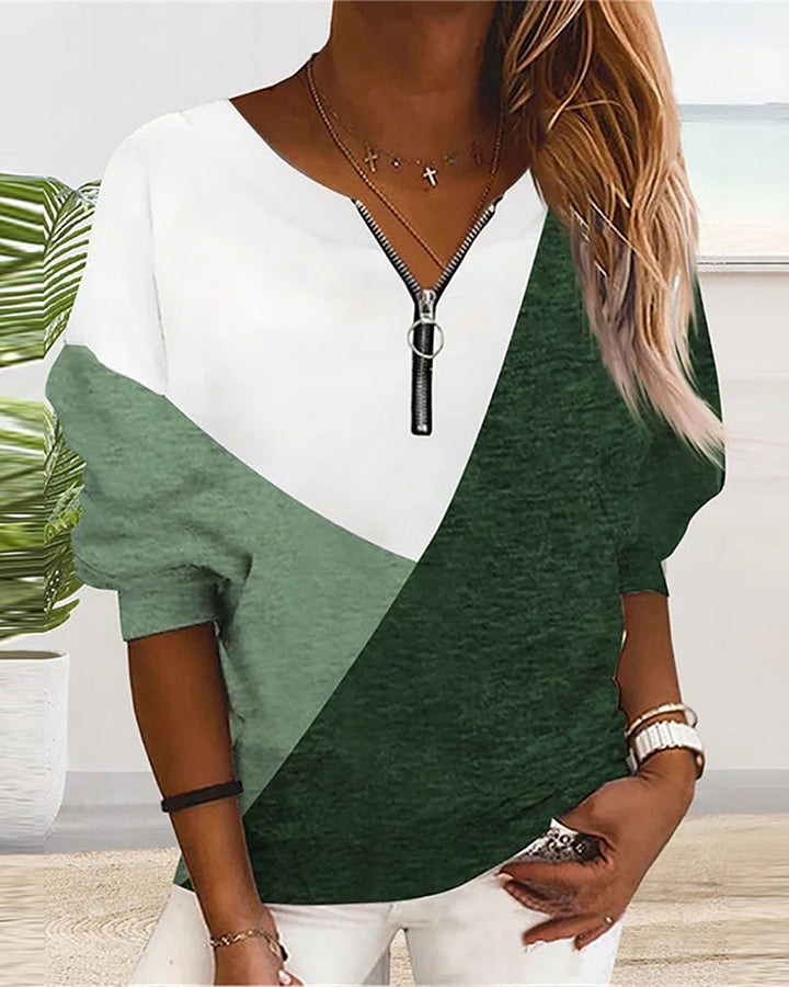 Comfortable women's color block V-neck zip sweatshirt. Long-sleeve design, great for casual style.