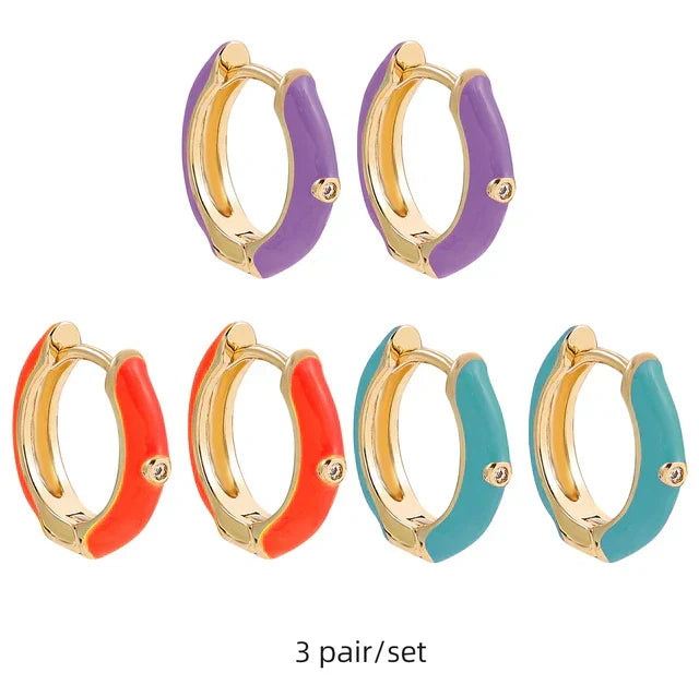 Fun women's colorful statement earrings, stylish gold-plated earcandy jewelry, vibrant fashion accessory.