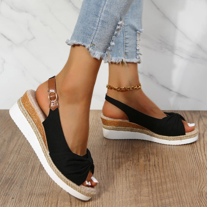 Close-up of ComfiLift women's wedge sandals, showcasing strap detail and comfort features.