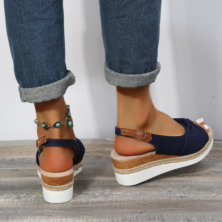 Walking in ComfiLift women's comfortable wedge sandals, ideal for all-day summer strolls.