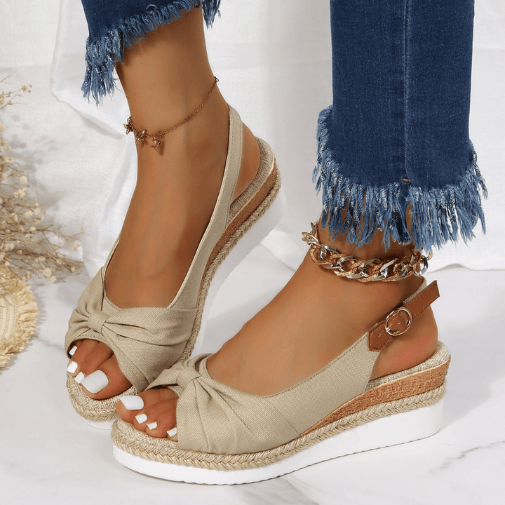 Women's ComfiLift wedge sandals in natural tones, offering stylish all-day comfort.