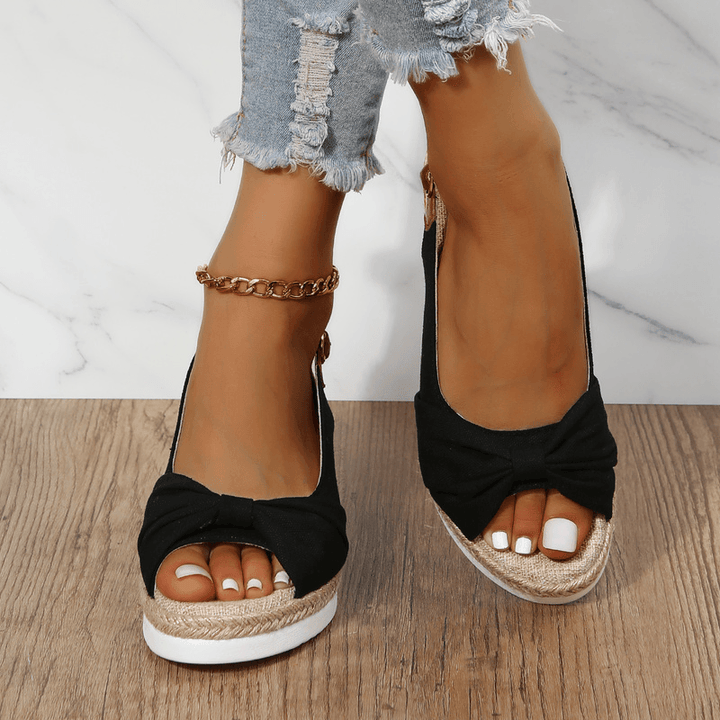 Ergonomic ComfiLift women's wedge sandals, providing all-day comfort and foot support.