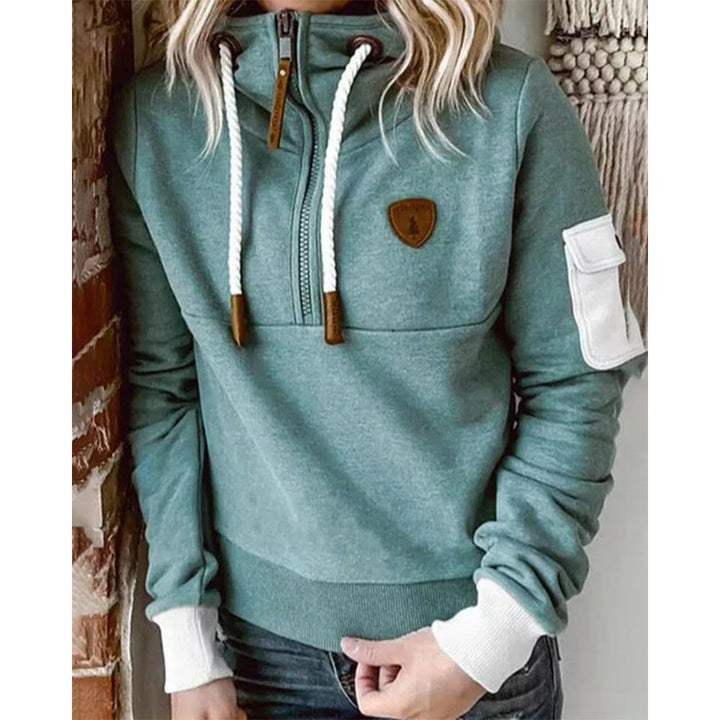 Everyday casual women's zip hoodie, comfortable solid color long sleeve top for fall, winter, and spring.