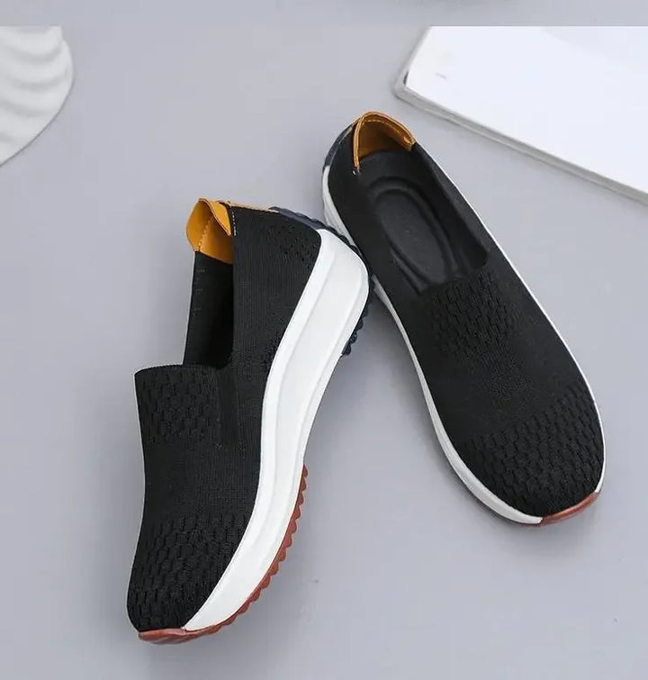 Casual women's slip-on walking shoes with responsive cushioning and a breathable knit upper for comfort.