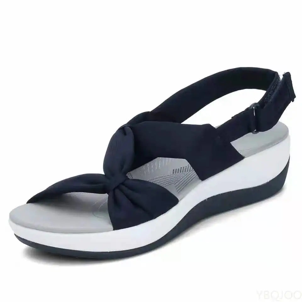 Stylish open toe women's flat sandals offering orthopedic comfort & essential arch support for walking.