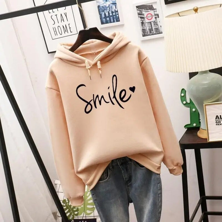 Women's comfort smile graphic hoodie, soft casual pullover for relaxed everyday wear.